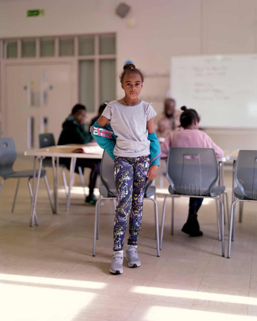Yolissa, nine. ‘One of the adults in the background is my dad, who is a voluntary teacher. I love being with the friends I’ve made here – we’re like a big family. We call our teachers Auntie and Uncle’
