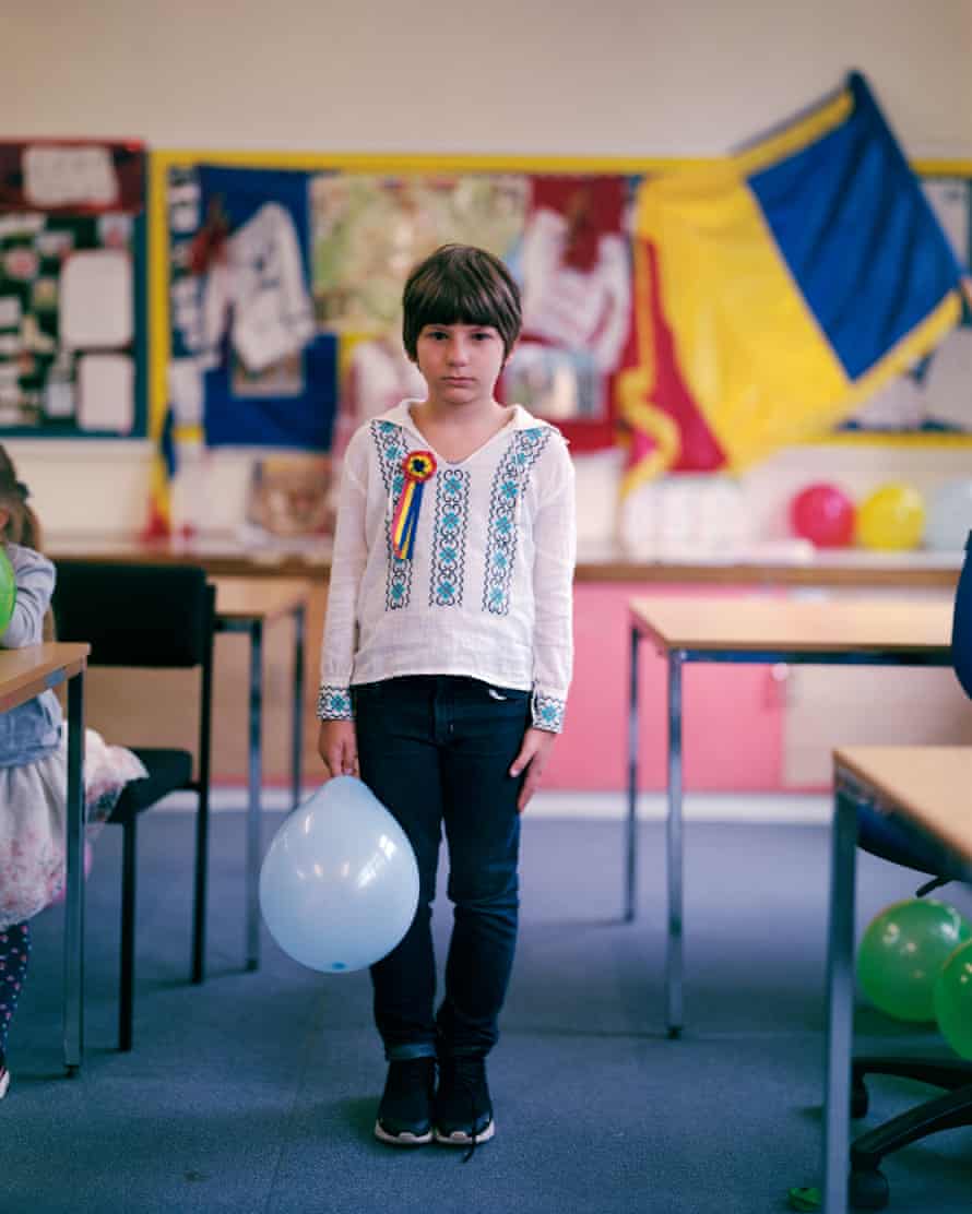 ‘Nicolae Iorga’ Romanian School, Wirral: Luca, eight, was born in Bucharest and has attended the school since it opened in 2018. This picture was taken on the first day back after a Covid-enforced period of online learning; to celebrate, the children wore Romanian dress and a rosette with the colours of the Romanian flag.