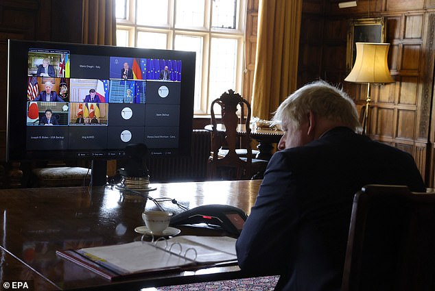 Mr Johnson joins the G7 Leaders Call from his country residence of Chequers yesterday